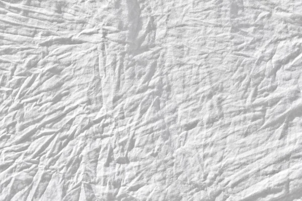 Wrinkled white fabic texture cloth texture ,Soft focus white fabic crumpled from bedding sheet use us background