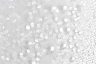 Soyut yumuşak gümüş parıltılı ışıklar kutlama arka planı