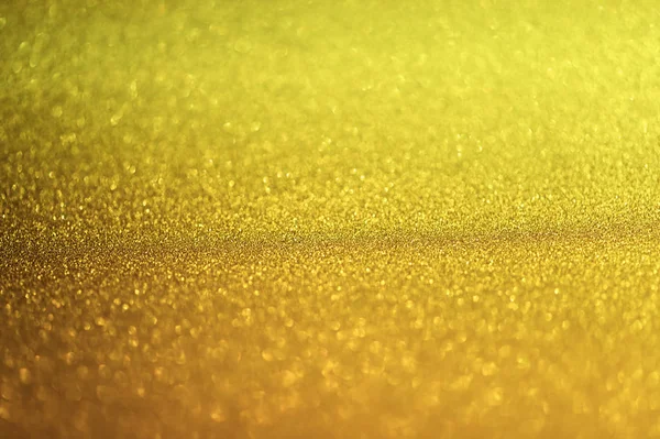 Abstrakta guld Glister bokeh bakgrund julbelysning, abstrakt suddig Bokeh Holiday festliga bakgrunden gjort med nyår i bakgrunden — Stockfoto