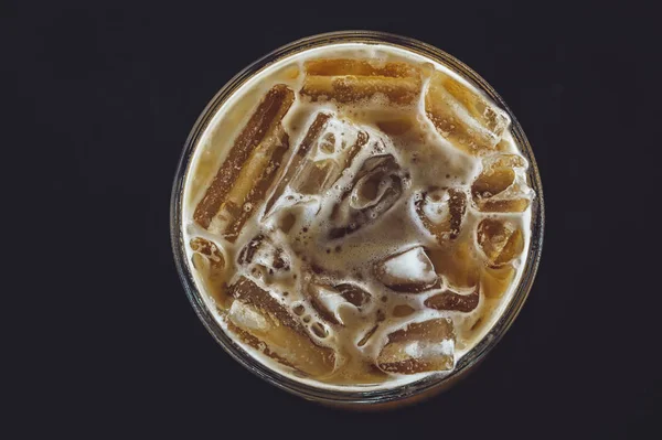 Cold coffee in glass on the dark table in cafe Top view — Stock Photo, Image