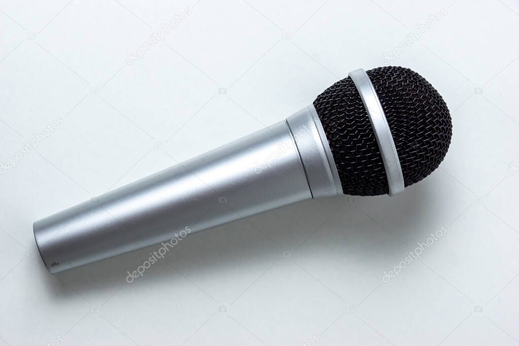 vocal microphone lying on a table without a cord