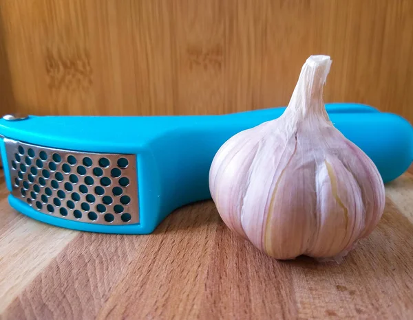 crush garlic on a wooden background