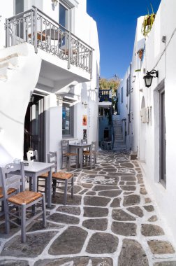 A typical street with white houses in Paros or Parikia, Cyclades islands, Greece
