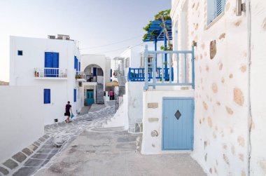 A typical street with white houses in Paros or Parikia, Cyclades islands, Greece