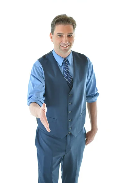 Business man holding out hand for a hand shake — Stock Photo, Image