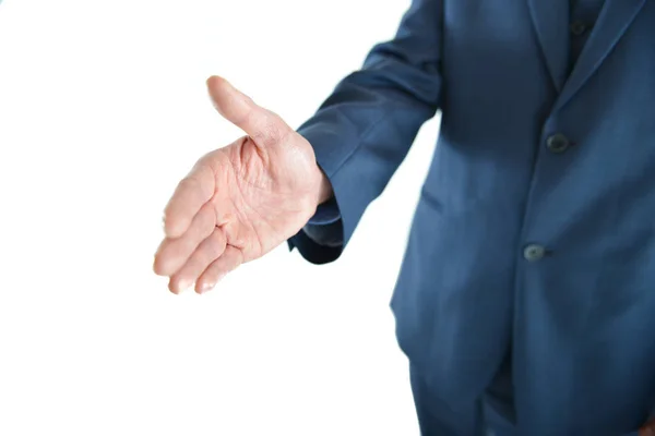 Homem de negócios dando a mão para um aperto de mão — Fotografia de Stock