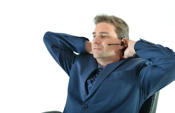 Geschäftsmann telefoniert mit Kunden- oder Kundendienstmitarbeiter Stockfoto