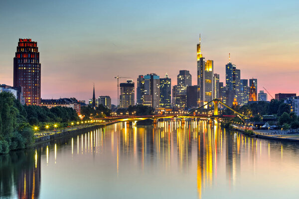 Frankfurt skyscrapers reflected on Main River at twilight, Germany
