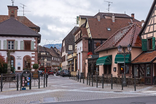 RIBEAUVILLE, HAUT- RHIN / FRANCE - NOVEMBER 7, 2017: The central street of a beautiful old village in late autumn