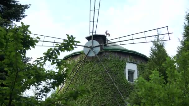 PRAGUE, CZECH REPUBLIC - MAY 21, 2016: A windmill behind trees — Stock Video