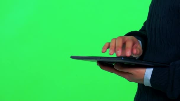 An Asian man works on a tablet — Stock Video