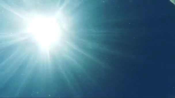 Detail of the water surface with sun in the sky — Stock Video