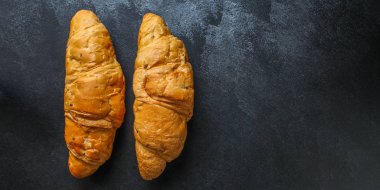 Kruvasan çöreği (lezzetli taze hamur işleri, sandviç rulosu) menü konsepti. Yemek geçmişi. Üst Manzara. Boşluğu kopyala