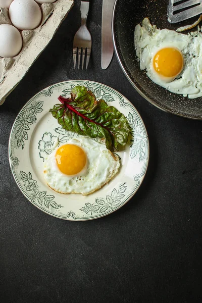 fried eggs in avocado(healthy breakfast, vitamins) menu concept. food background. top view. copy space