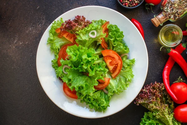 Healthy salad, leaves mix salad (mix micro greens, cucumber, tomato, chili pepper, other ingredients). food background. copy space