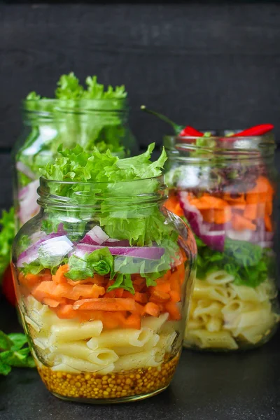 healthy salad in a jar (vegetable snack pasta salad) menu concept. food background. top view. copy space