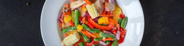 frozen vegetables mix salad (onions, corn, peppers, paprika, mushrooms, asparagus beans, carrots and others, ketogenic diet) menu concept. food background. top view. copy space