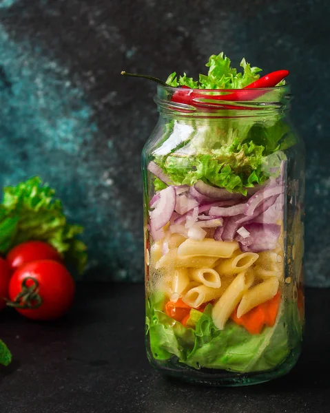 healthy salad in a jar (vegetable snack pasta salad) menu concept. food background. top view. copy space