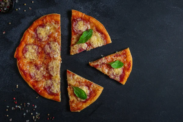 pizza salami sausages (tomato sauce, cheese, meat). food background. top view. copy space