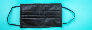 Virüs koruması için yüz maskesi, sağlık güvenliği için siyah renk. arkaplan, üst manzara. metin için boşluk kopyala
