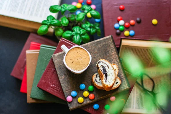cup of coffee and bun dessert, reading books Menu concept. food background top view copy space