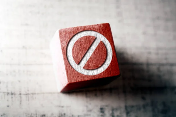 Prohibition Sign On A Red Wooden Block On A Table — Stock Photo, Image