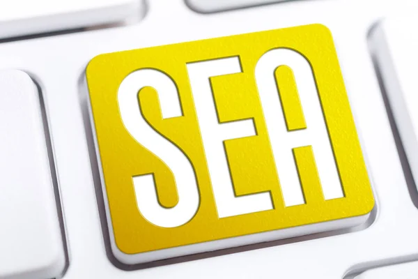 Yellow SEA Search Engine Advertising Button On A White Keyboard, Business Marketing Concept