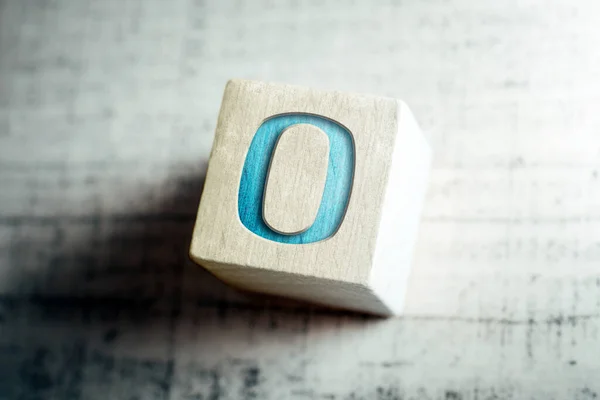 Number 0 On A Wooden Block On A Table — Stock Photo, Image