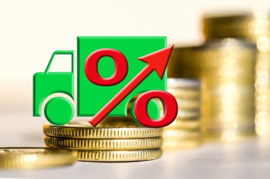 Kamyon ve kırmızı yüzde para bir arka plan üzerinde oturum açın.
