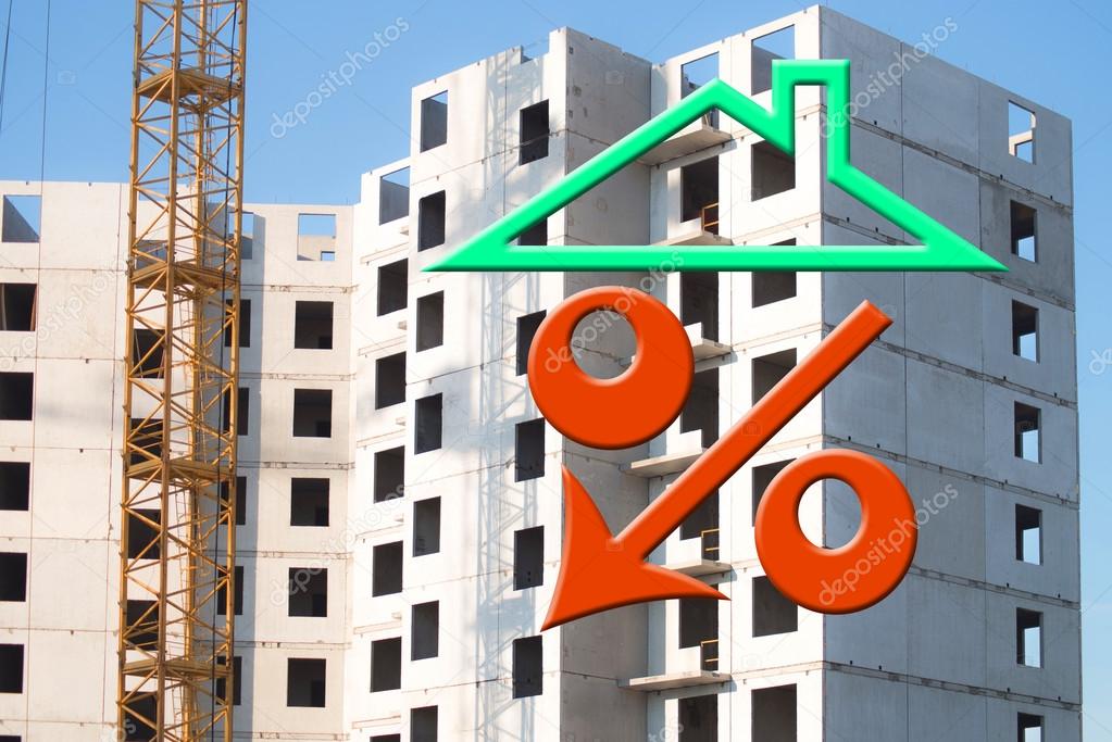 Red percent sign on the background of building a house . 
