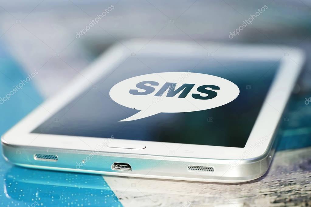 The symbol sms on the screen cell phone .
