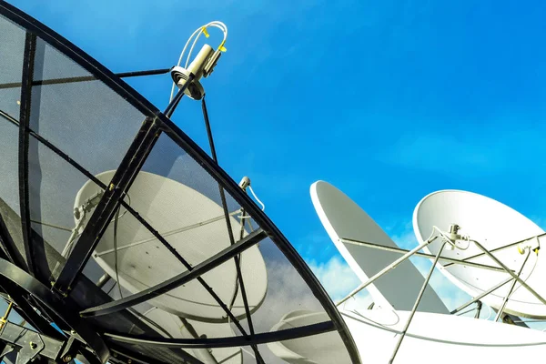 Satellite dish on blue sky background — Stock Photo, Image