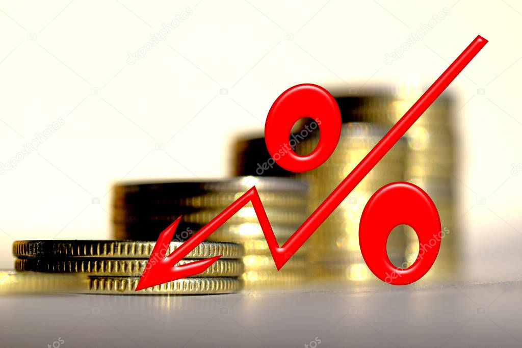 Red percent sign on a background of money . 