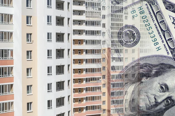 The facade of a tall building in the background of the Bank bills . The concept of development of the real estate market