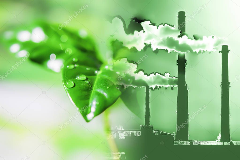 Industrial factory chimneys on background of green plants . 