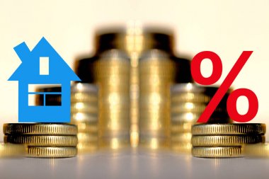 The percent symbol and real estate on a background of money . clipart