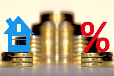 The percent symbol and real estate on a background of money . clipart