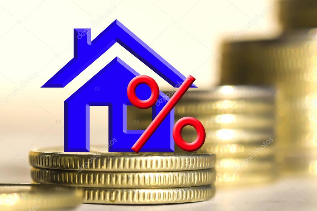 The percent symbol and real estate on a background of money . 