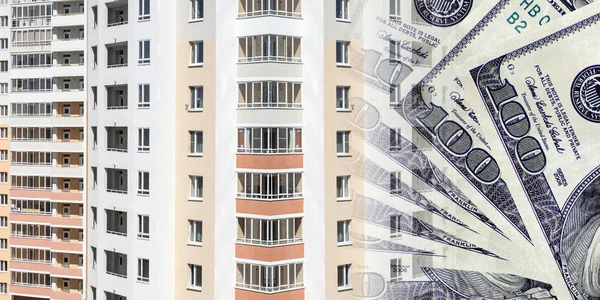 The facade of a residential high-rise house on a background of money . — Stock Photo, Image