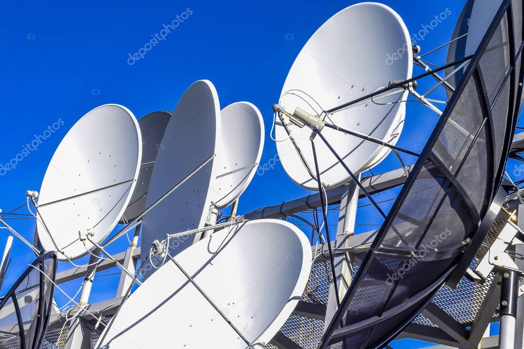 Equipment to connect satellite and cable services on the background of blue sky . 