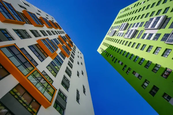 The facade of the new residential high-rise buildings against the sky . The concept of building a typical residential neighborhood
