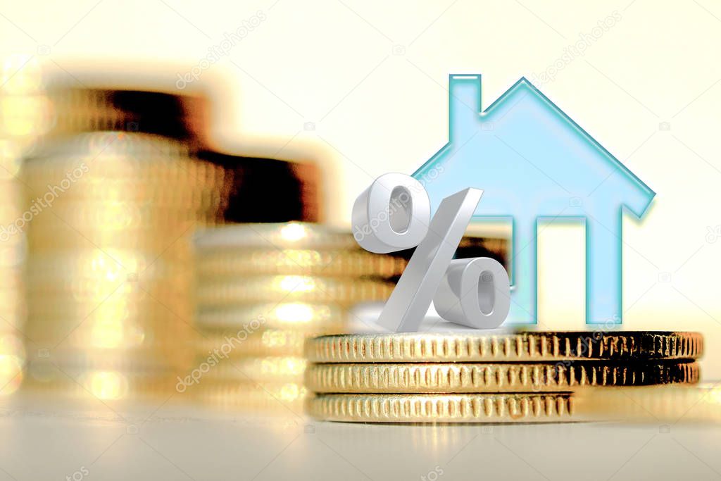 The percent symbol on the background of bars coins . The concept of mortgage lending .