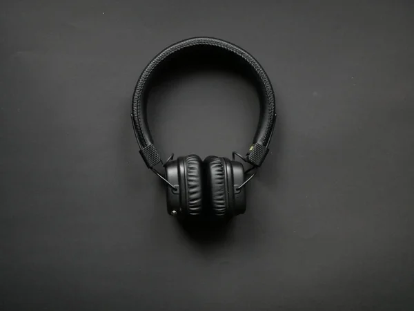 Black headphones on background — Stock Photo, Image