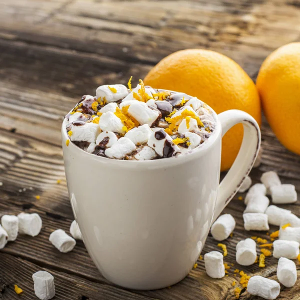Cup of hot cocoa with chocolate orange and  zest on  dark wooden background. selective focus — Stock Photo, Image