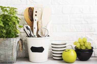 Kitchen still life on a white brick wall background clipart