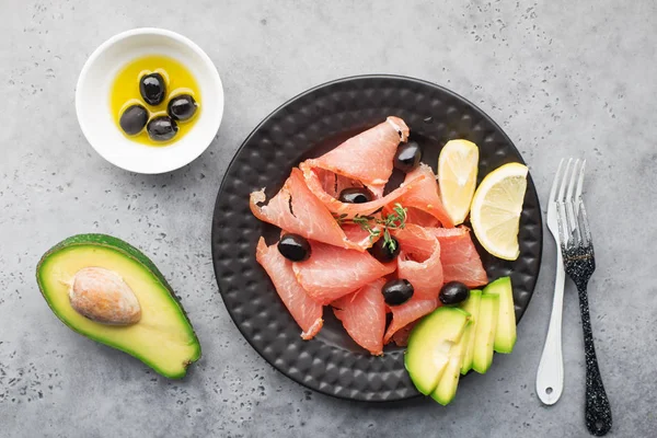 Meat, avocado, olives are an excellent keto snack. Low carbohydrate nutrition. Diet option. Top view,