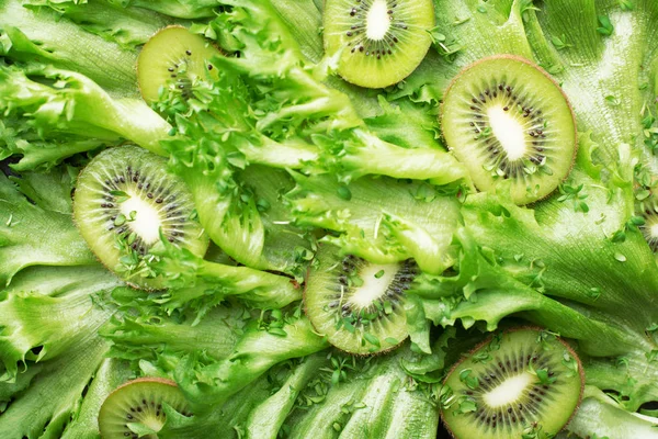 Green food background. Kiwi, salad leaves, microgreens, blueberries, refreshing smoothies, proper nutrition, eco-friendly clean cosmetics based on natural ingredients. Vegetarianism, paleo diet. Top