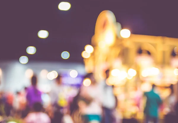 Blurred background: crowd of people in expo fair with bokeh ligh — Stock Photo, Image