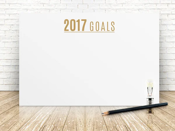 2017 meta año texto sobre papel blanco cartel con lápiz negro y — Foto de Stock