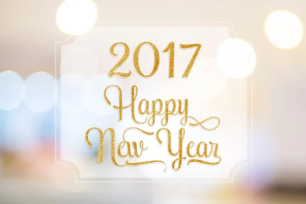 Feliz Año Nuevo 2017 palabra en marco blanco en boke borroso abstracto —  Fotos de Stock